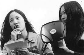 Asian American woman activist with bull horn